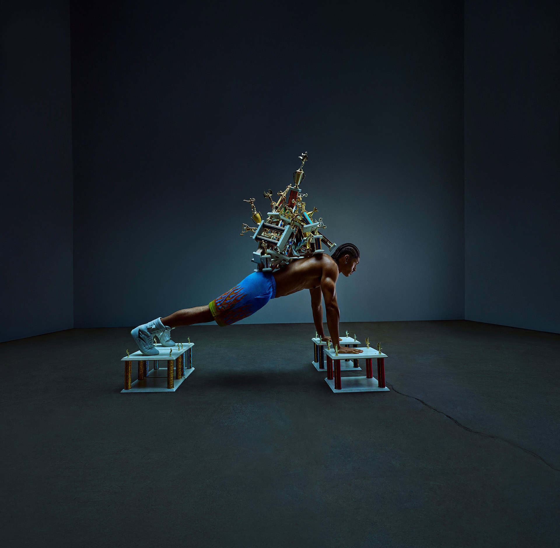 essentia-pushup Athlete doing pushup with trophies on back