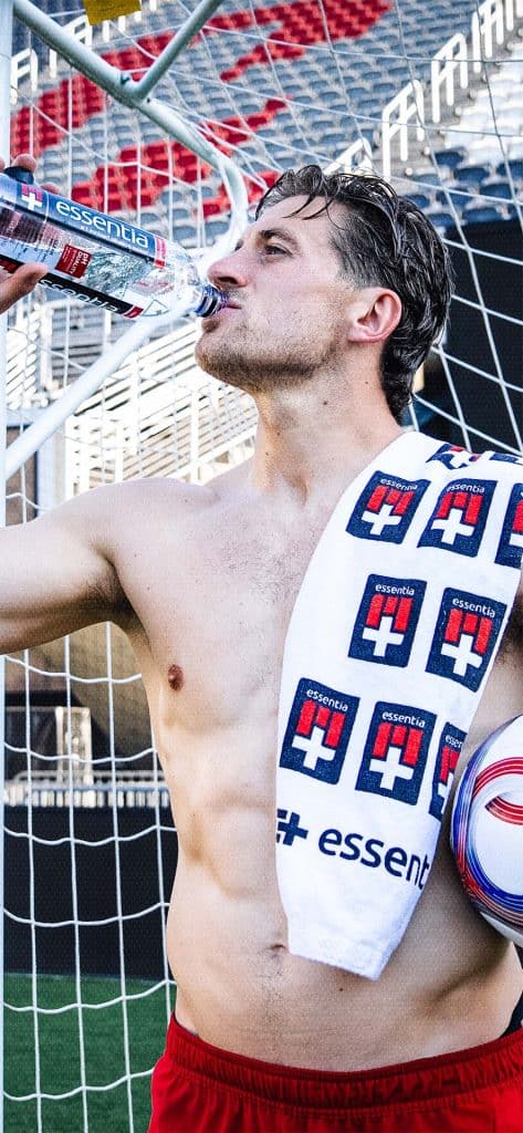 Lucas Bartlett drinking Essentia Water wallpaper